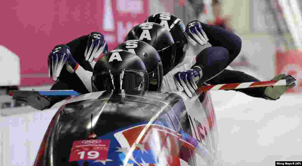 Bobsled: Driver Justin Olsen, Christopher Fogt, Carlo Valdes and Nathan Weber of the United States start their third heat during the four-man bobsled competition final at the 2018 Winter Olympics in Pyeongchang, South Korea, Sunday, Feb. 25, 2018. (AP Photo/Wong Maye-E)