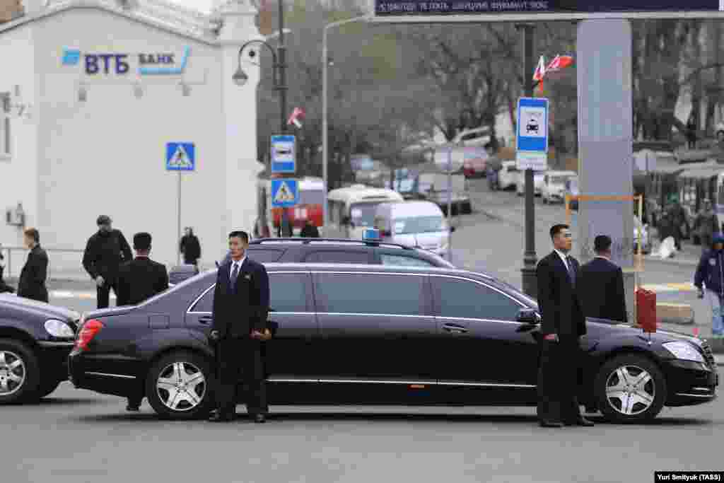 North Korean security personnel guard a car before Kim&#39;s arrival in Vladivostok.&nbsp;&nbsp;