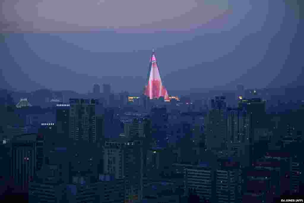 A light show is displayed on the Ryugyong hotel amid the city skyline of Pyongyang. North Korea is preparing to mark the 70th anniversary of its founding on September 9. (AFP/Ed Jones)