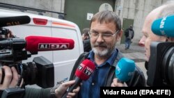 Mikhail Bochkaryov speaks to reporters after he was released in Oslo on October 19.