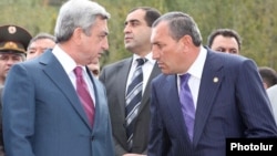 Armenia - President Serzh Sarkisian (L) and Surik Khachatrian, governor of Syunik province, attend an official ceremony.