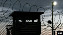 Night falls at Guantanamo Bay detention center's Camp Delta in February 2006.