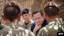 British Prime Minister David Cameron meets British soldiers based at Lashkar Gah in Helmand Province.