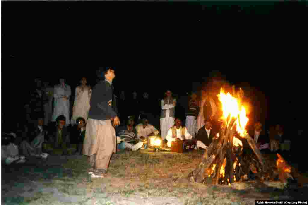 Student enjoying a bonfire during a retreat. 