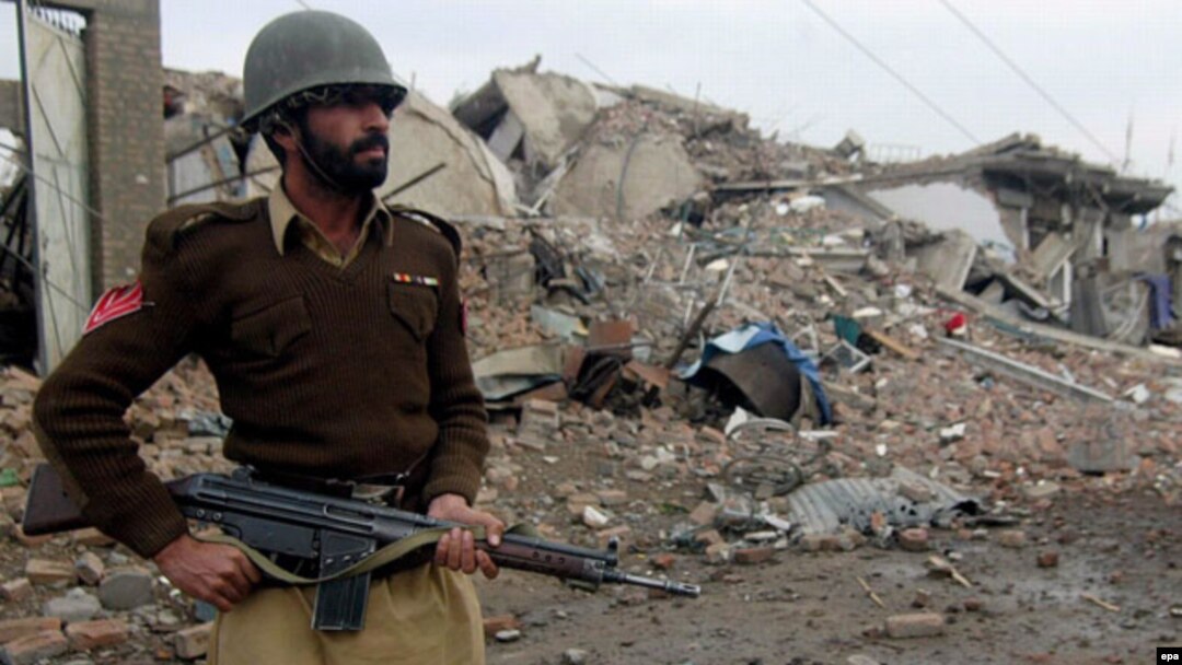 A Pakistani soldier at the site of a market destroyed in fighting between pro-Taliban militants and security forces in North Waziristan.