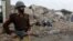 A Pakistani soldier at the site of a market destroyed in fighting between pro-Taliban militants and security forces in North Waziristan.