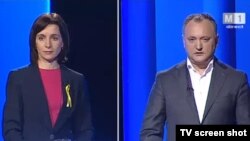 Кандидаты в президенты Молдовы Майя Санду (слоева) и Игорь Додон во время теледебатов. 
