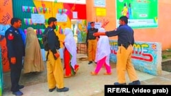 Pakistani voters in the city of Mardan on October 14