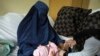 A child receives a measles vaccine at the Indira Gandhi Children's Hospital in Kabul.