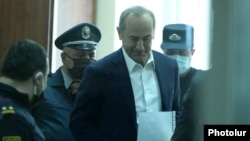 Ex-President Robert Kocharian is brought to a courtroom in Yerevan on May 8.