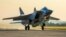A Russian MiG-31 fighter jet carrying a Kinzhal missile takes off from the Hemeimeem air base in Syria in 2021. 