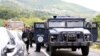 KOSOVO -- Kosovo special police with armored vehicles stand on the road near the northern Kosovo border crossing of Jarinje, September 20, 2021