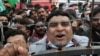 A supporter of the Pakistan Democratic Movement (PDM), an alliance of political opposition parties, chants slogans at an anti-government protest rally in Lahore on December 13. 