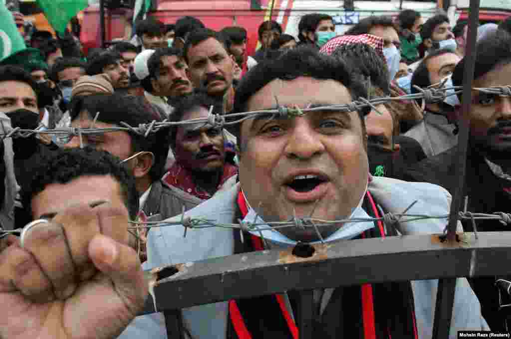 A supporter of the Pakistan Democratic Movement, an alliance of political opposition parties, chants slogans as he attends an anti-government rally in Lahore on December 13. (Reuters/Mohsin Raza)