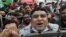 A supporter of the Pakistan Democratic Movement (PDM), an alliance of political opposition parties, chants slogans at an anti-government protest rally in Lahore on December 13. 