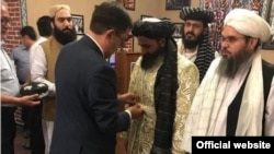 Taliban representatives meeting with Uzbek officials in 2019.