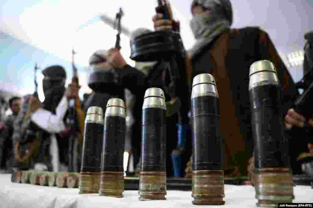 Former Taliban members surrender their weapons during a reconciliation ceremony in the western Afghan province of Herat on February 21. (EPA-EFE/Jalil Rezayee)