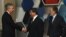 Turkish Foreign Minister Ahmet Davutoglu (center), accompanied by his Afghan counterpart Zalmay Rasul (right), shakes hands with U.S. Deputy Secretary of State William Burns before the Istanbul Conference on November 2.