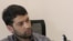 Daler Sharifov speaks during an interview with RFERL on January 30.