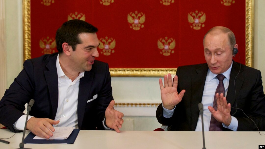 Greek Prime Minister Alexis Tsipras (left) speaks with Russian President Vladimir Putin during a signing ceremony at the Kremlin in Moscow in April.