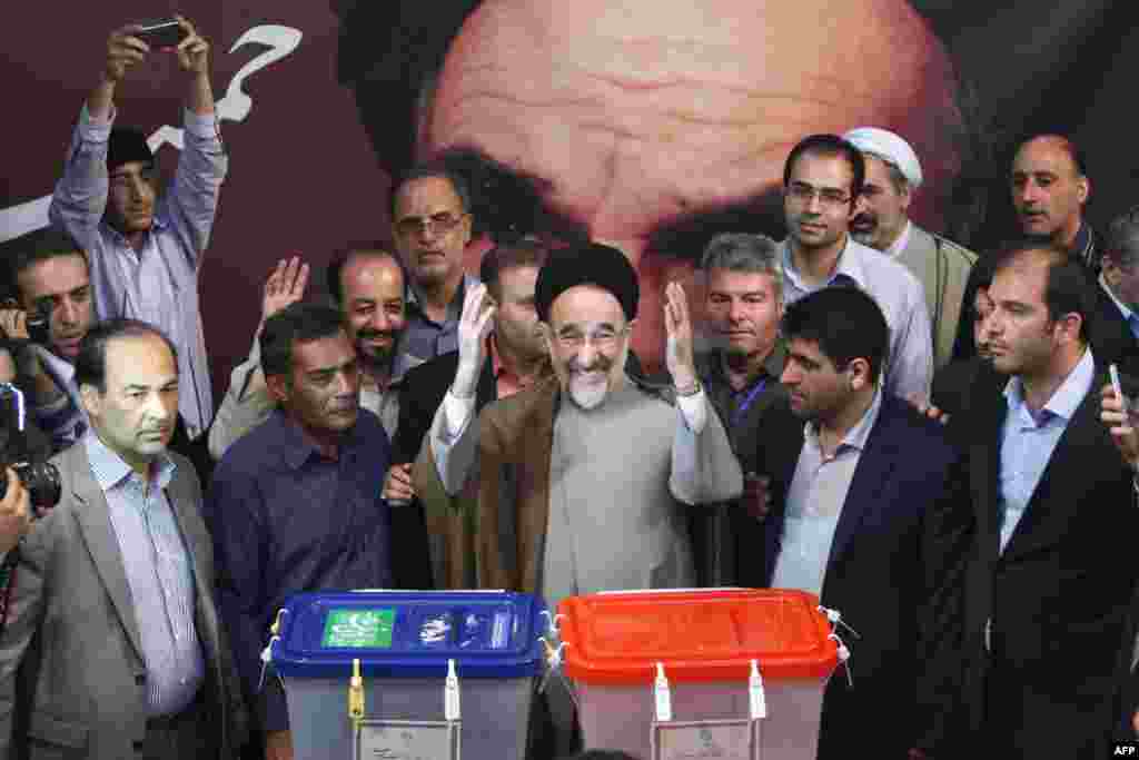 Former President Mohammad Khatami casts his vote at a polling station in Tehran.