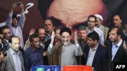 File photo - Former president Mohammad Khatami casts his vote at a polling station in Tehran, after supporting the first election of Hassan Rouhani. June 14, 2013