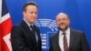 British Prime Minister David Cameron (left) is welcomed by President of the European Parliament Martin Schulz prior to meetings at the European Parliament in Brussels, Belgium, on February 15.