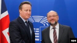 British Prime Minister David Cameron (left) is welcomed by President of the European Parliament Martin Schulz prior to meetings at the European Parliament in Brussels, Belgium, on February 15.