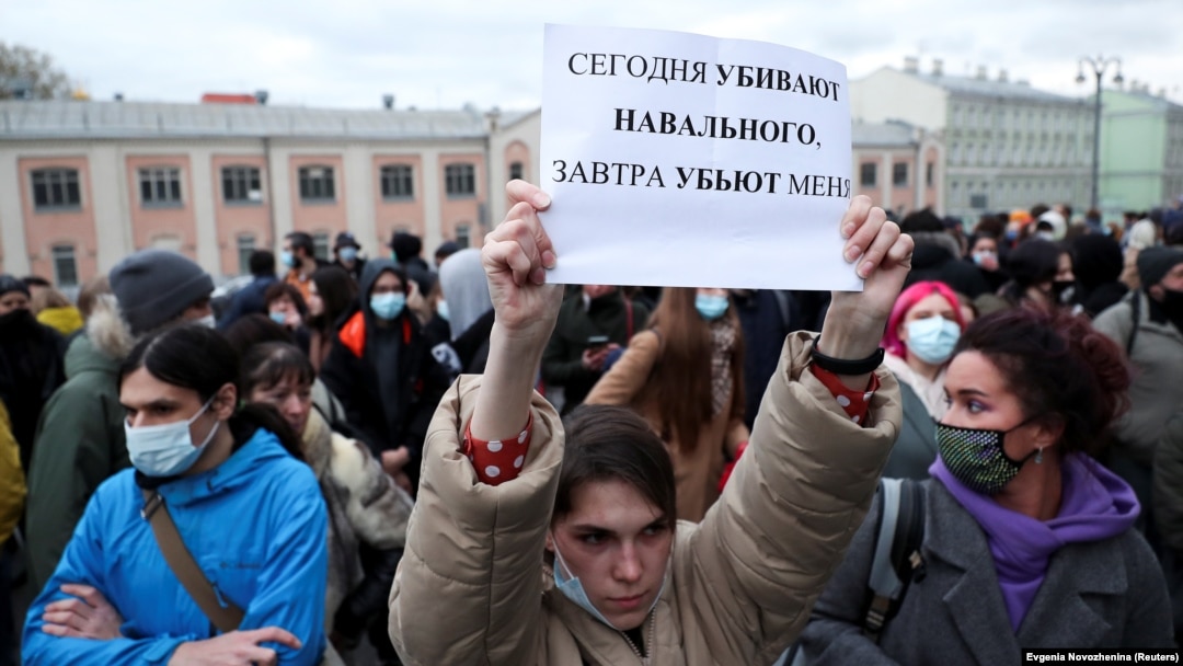 A demonstrator holds up a sign reading "Today they kill Navalny, tomorrow they kill me" during a rally in Moscow on April 21.