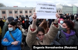 A demonstrator holds up a sign reading "Today they kill Navalny, tomorrow they kill me" during a rally in Moscow on April 21.