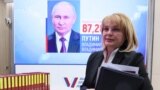 Russian Central Election Commission chief Ella Pamfilova walks past a screen displaying a portrait of President Vladimir Putin following the announcement of the official results in a three-day presidential election in Moscow on March 21. 