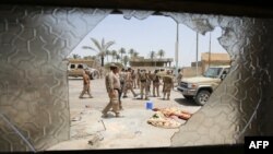 Iraqi soldiers patrol streets near the city of Fallujah last month during an operation to regain territory from the extremist Islamic State group.