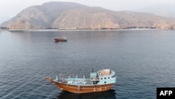 Boats are anchored off Oman’s northern Musandam Peninsula near the Strait of Hormuz on June 27.