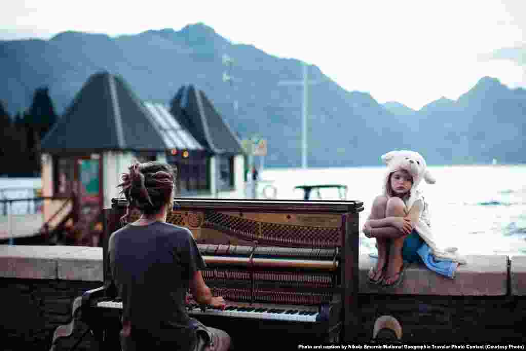 Merit Award: &quot;Piano Play At Sunset&quot; by Nikola Smernic: &quot;Streets of Queenstown, New Zealand, at the end of one more day filled with adrenaline. Calming and doleful scene with piano sound in the background.&quot;