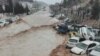 Vehicles are stacked one against another after a flash flooding In Shiraz, Iran, March 25, 2019. 