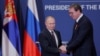 Russian President Vladimir Putin presents Serbian President Aleksandar Vucic with an Order of Alexander Nevsky after meeting in Belgrade in 2019.
