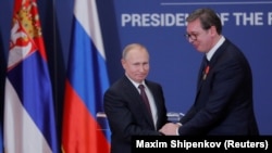 Russian President Vladimir Putin presents Serbian President Aleksandar Vucic with an Order of Alexander Nevsky after meeting in Belgrade in 2019.
