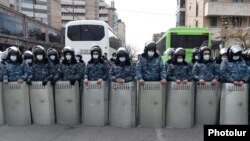 Armenia -- Riot police are seen outside the Armenian parliament building in Yerevan during opposition protests, March 10, 2021.