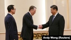 Reprezentantul american la negocieri Robert Lighthizer la primirea sa de către președintele Xi Jinping la 15 februarie 2019