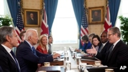 Britain's Prime Minister Keir Starmer, right, and Foreign Secretary David Lammy, second right, during a meeting with US President Joe Biden, centre left, in the Blue Room at the White House in Washington, September 13, 2024.