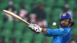 <p>Afghanistan's Mohammad Nabi is hit by the ball during a one-day international cricket match against England in Lahore, Pakistan. 