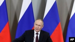 Владимир Путин, раисҷумҳури Русия.