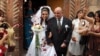 Armenia - A newlywed couple emerges from a church.