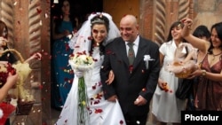 Armenia - A newlywed couple emerges from a church.