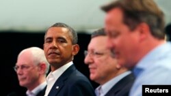 U.S. President Barack Obama (second from left), with British Prime Minister David Cameron (right), European Council President Herman Van Rompuy (left), and European Commission President Jose Manuel Barroso at the G8 summit in Enniskillen, Northern Ireland.