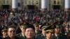 Military delegates leave the Great Hall of the People after the opening ceremony.