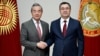 Chinese Foreign Minister Wang Yi (left) meets Kyrgyz President Sadyr Japarov in Bishkek on November 19 during a three-country tour of Central Asia. 