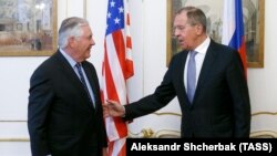 AUSTRIA -- U.S. Secretary of State Rex Tillerson (L) and Russian Foreign Minister Sergei Lavrov meet on the sidelines of an annual session of the OSCE Council of Foreign Ministers in Vienna, December 7, 2017