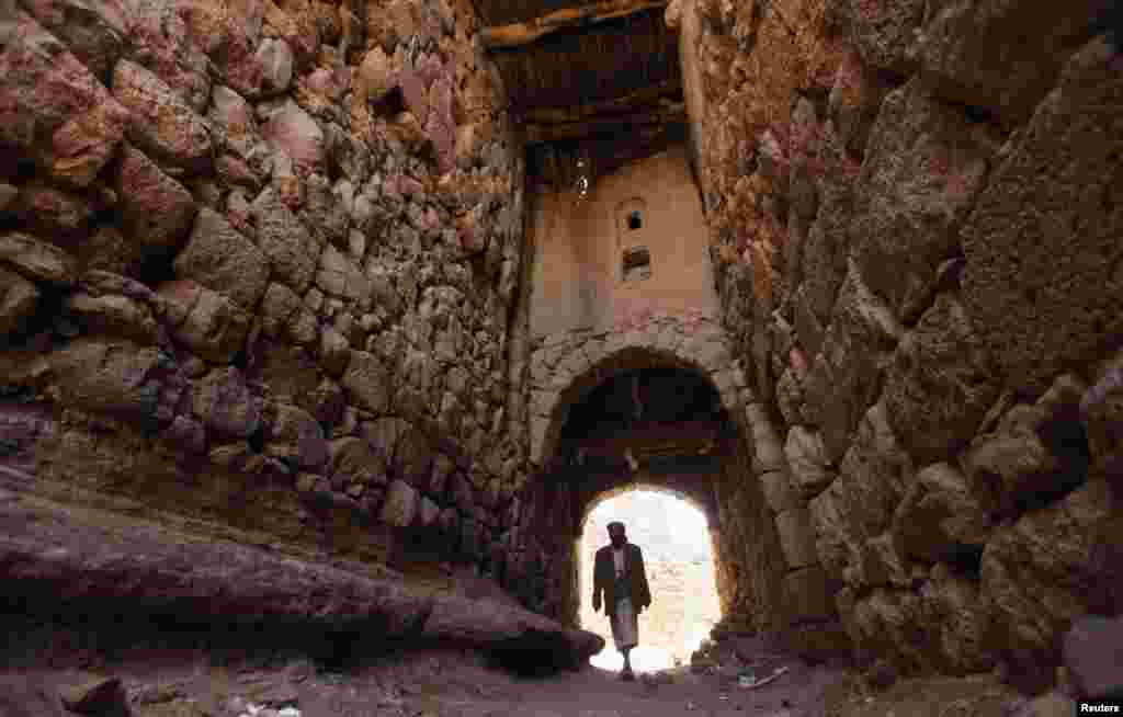 A man walks in an alley in the village of Al-Gorza Hamdan, northwest of the Yemeni capital, Sanaa. (Reuters/Mohamed al-Sayaghi)