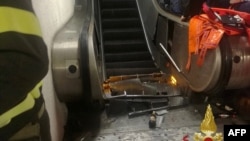 This photo, released by the Italian fire and rescue service, shows the scene at the bottom of the escalator after the injured had been taken to the hospital.